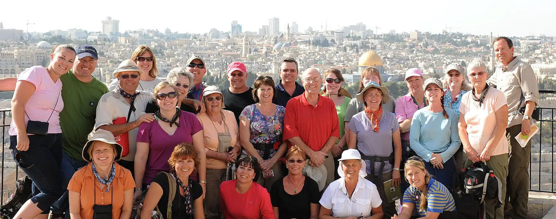 A photo of a group with Jerusalem in the background.